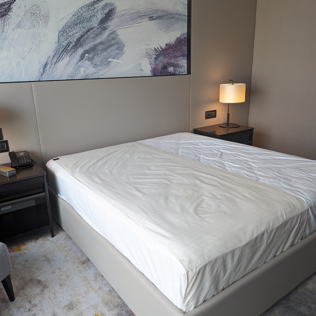 flat grounding sheet on a double size bed 